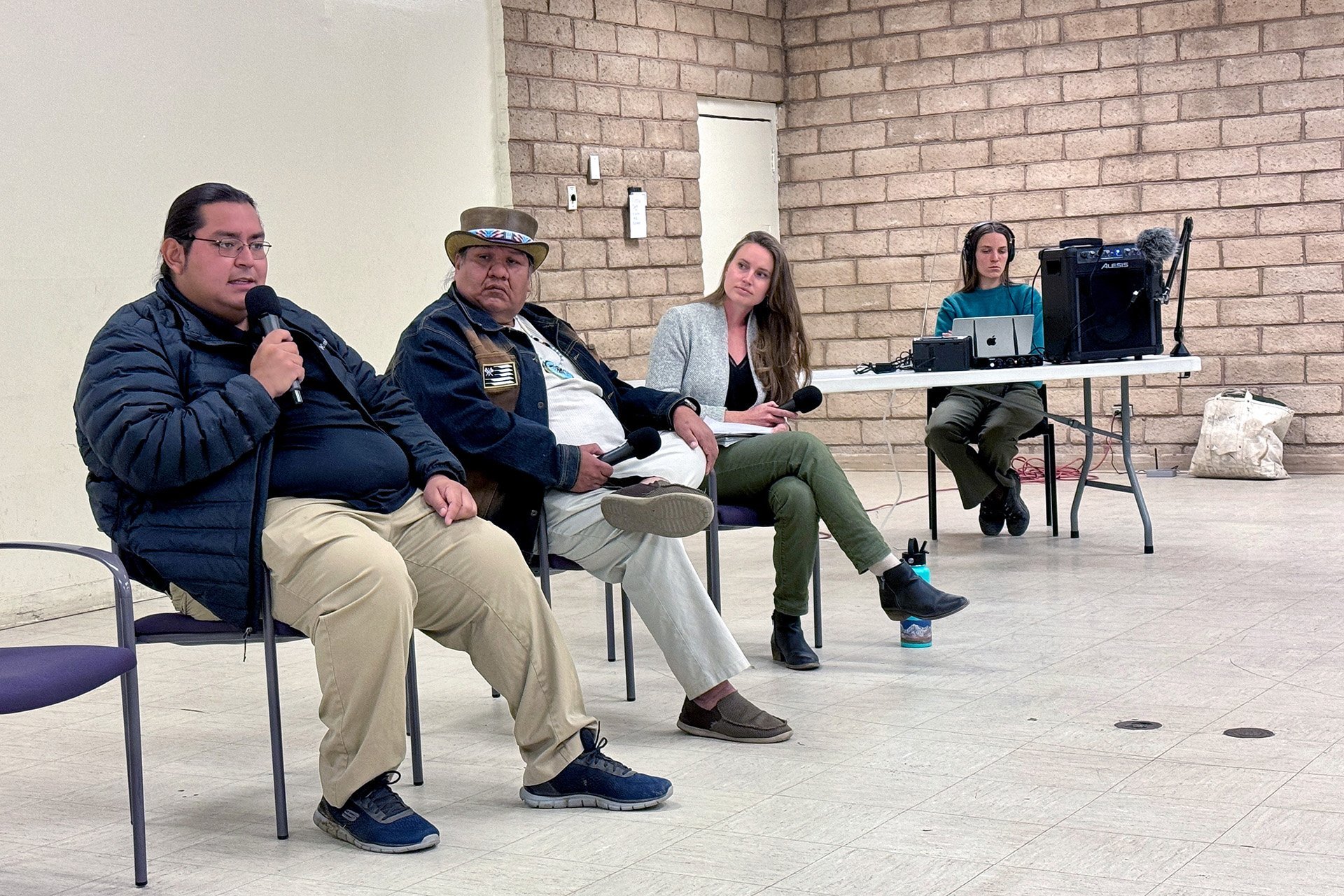Our first Alabama Gates 2024 panel discussion at Statham Hall in Lone Pine on Saturday, Nov 16, 2024, with Payahüünadü Tribal representatives (left to right) Noah Williams, Water Program Coordinator for the Big Pine Paiute Tribe; Kyndall Noah, Communications Specialist, OVIWC; with Dr. Sophia Borgias, Assistant Professor at Boise State University as panel moderator. Metabolic's Audrey Clementine Turner (far right) broadcasts the event live on 89.9 FM.